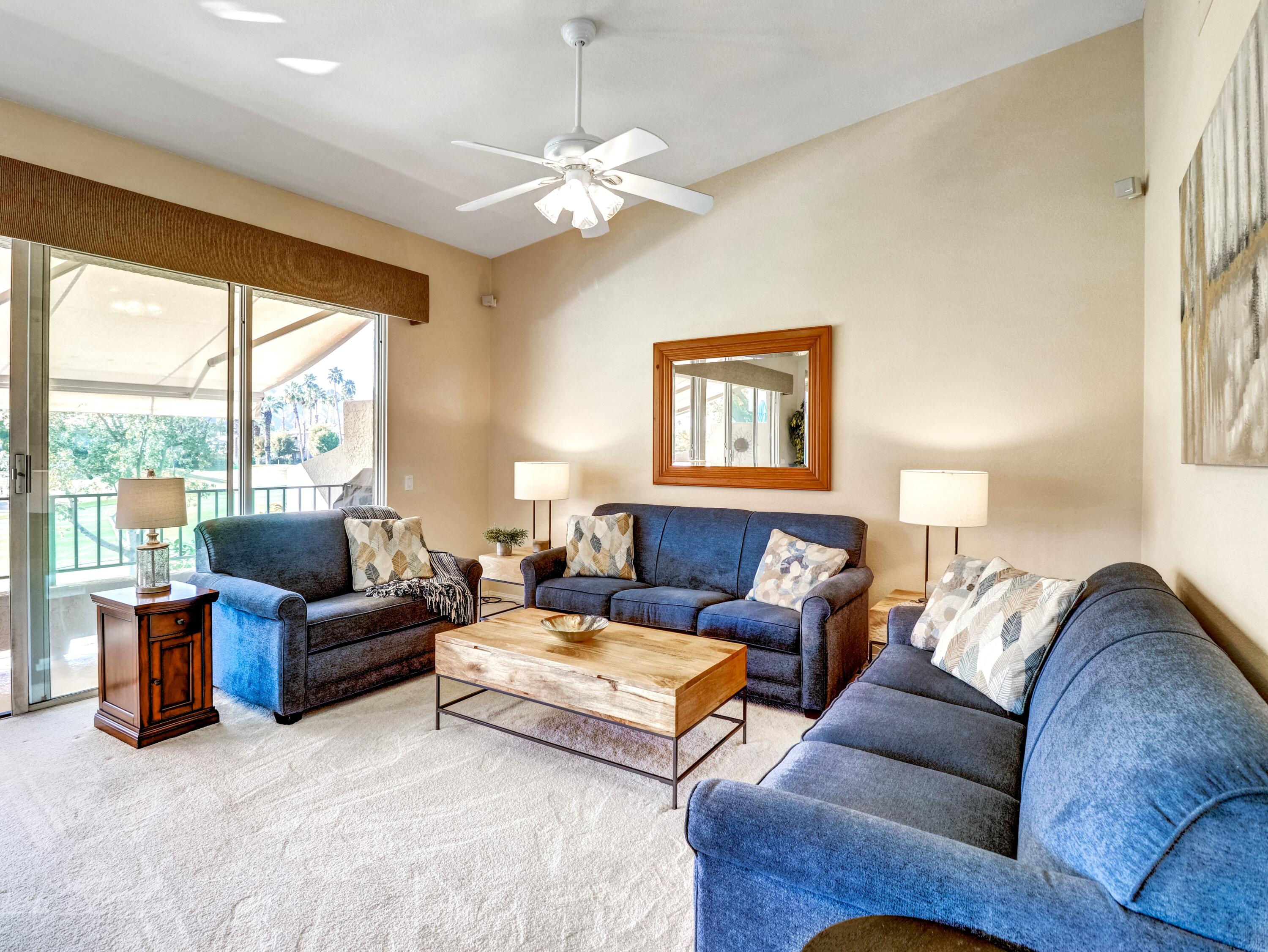 55393 Winged Foot La Quinta, CA 92253 - Photo 4 of 29 a living room with furniture and a large window