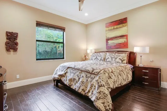 a bedroom with a bed and a night stand