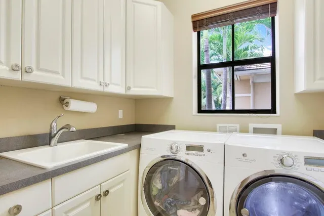 a utility room with dryer and washer