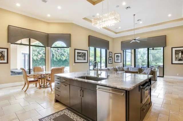 a dining table with chairs and couches