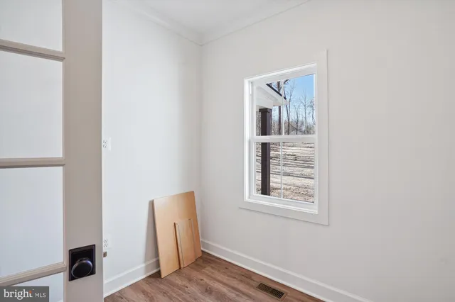 a view of a room with wooden stairs