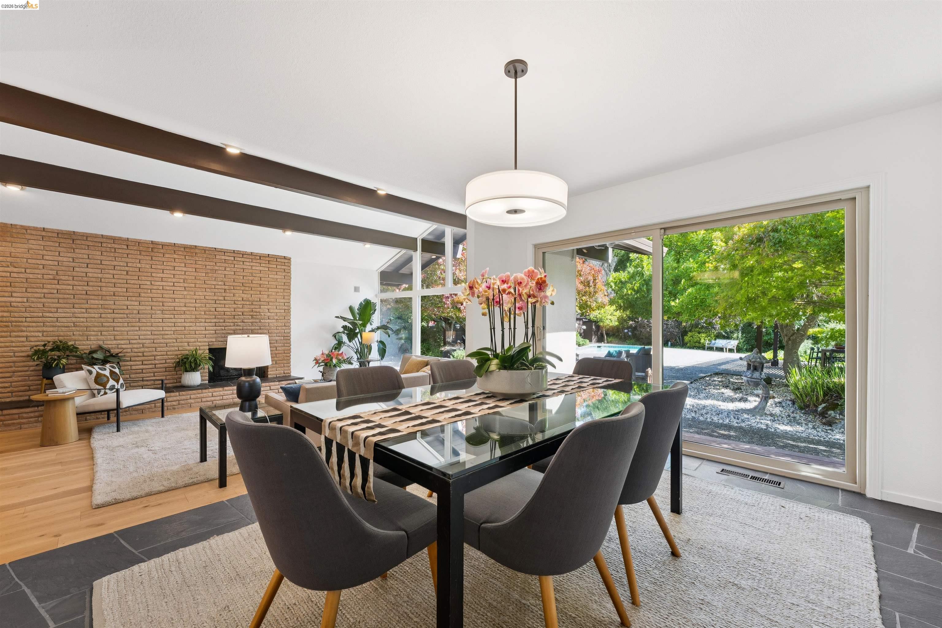 7 Jo Lin Court El Sobrante, CA 94803 - Photo 41 of 99 Dining area with slate tile flooring, a contemporary pendant light fixture, and a large sliding glass door