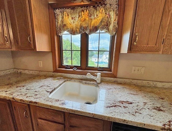 29 Highland View Drive Sutton, MA 01590 - Photo 14 of 40 a view of a kitchen with a sink a window and cabinets