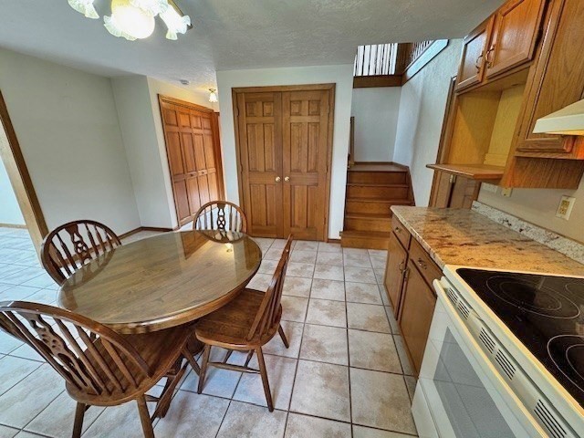 29 Highland View Drive Sutton, MA 01590 - Photo 15 of 40 a kitchen with a sink a table and chairs