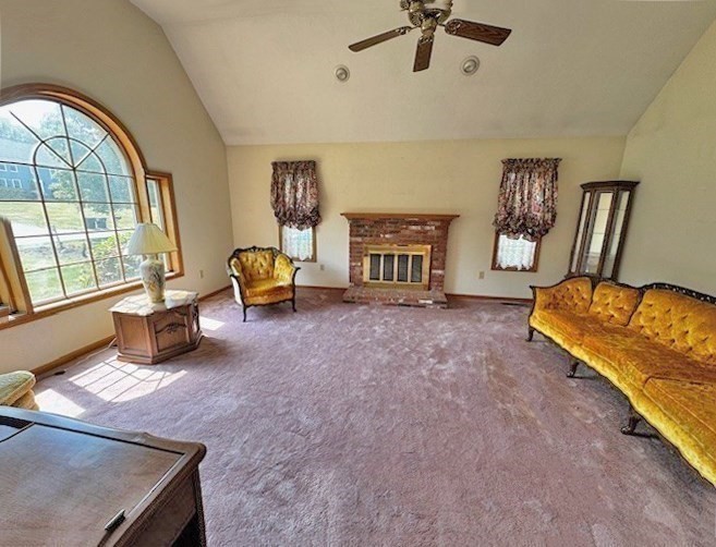 29 Highland View Drive Sutton, MA 01590 - Photo 8 of 40 a living room with furniture and a fireplace