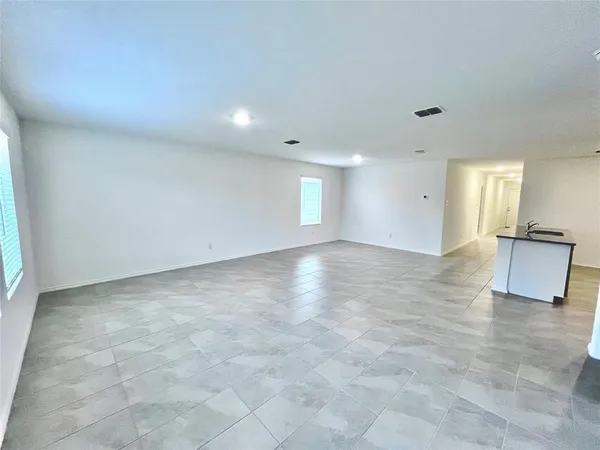 a view of a hall with an entryway