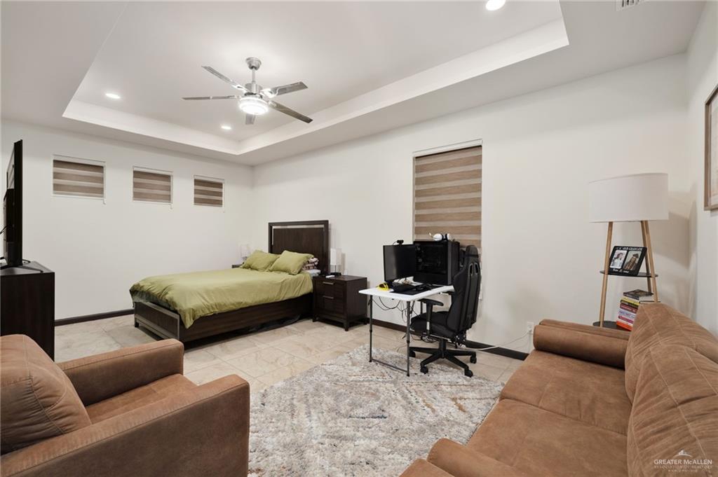 2615 South 43 Rd Lane McAllen, TX 78503 - Photo 13 of 22 a bedroom with a bed and a couch