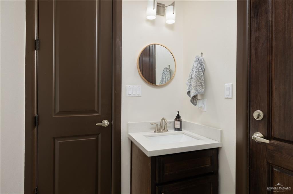 2615 South 43 Rd Lane McAllen, TX 78503 - Photo 20 of 22 a bathroom with a sink and a mirror