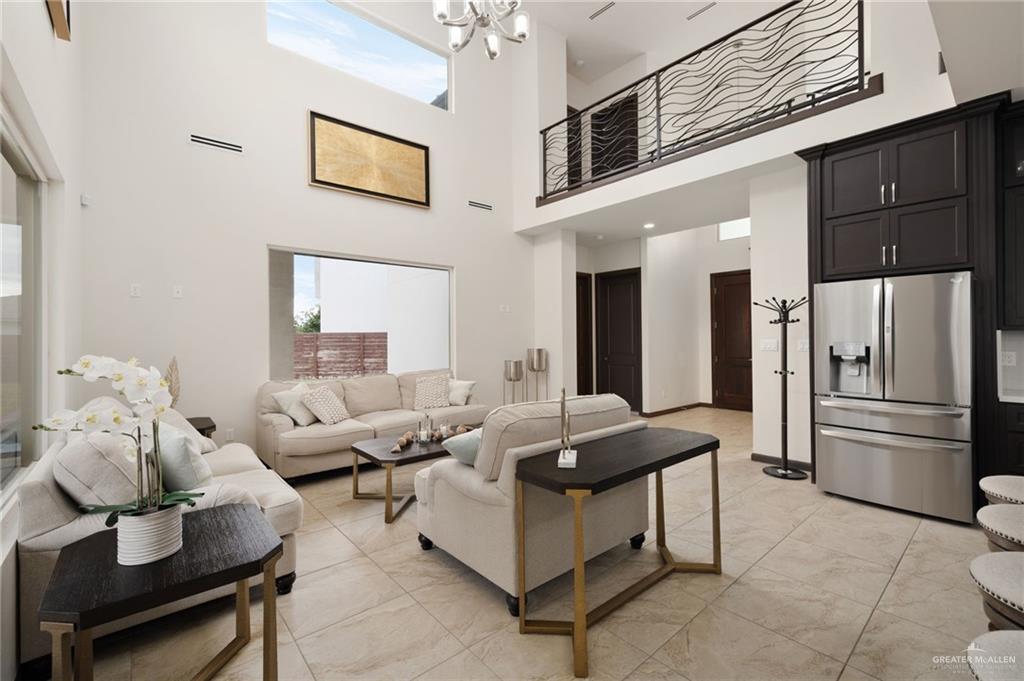 2615 South 43 Rd Lane McAllen, TX 78503 - Photo 3 of 22 a living room with furniture and a refrigerator