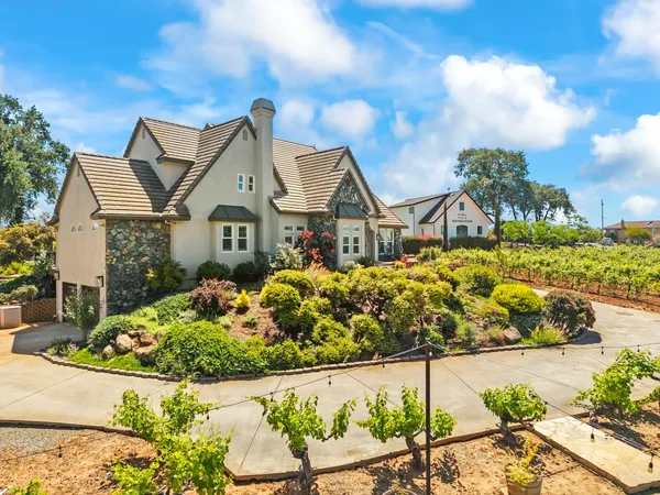 an aerial view of a house with a garden