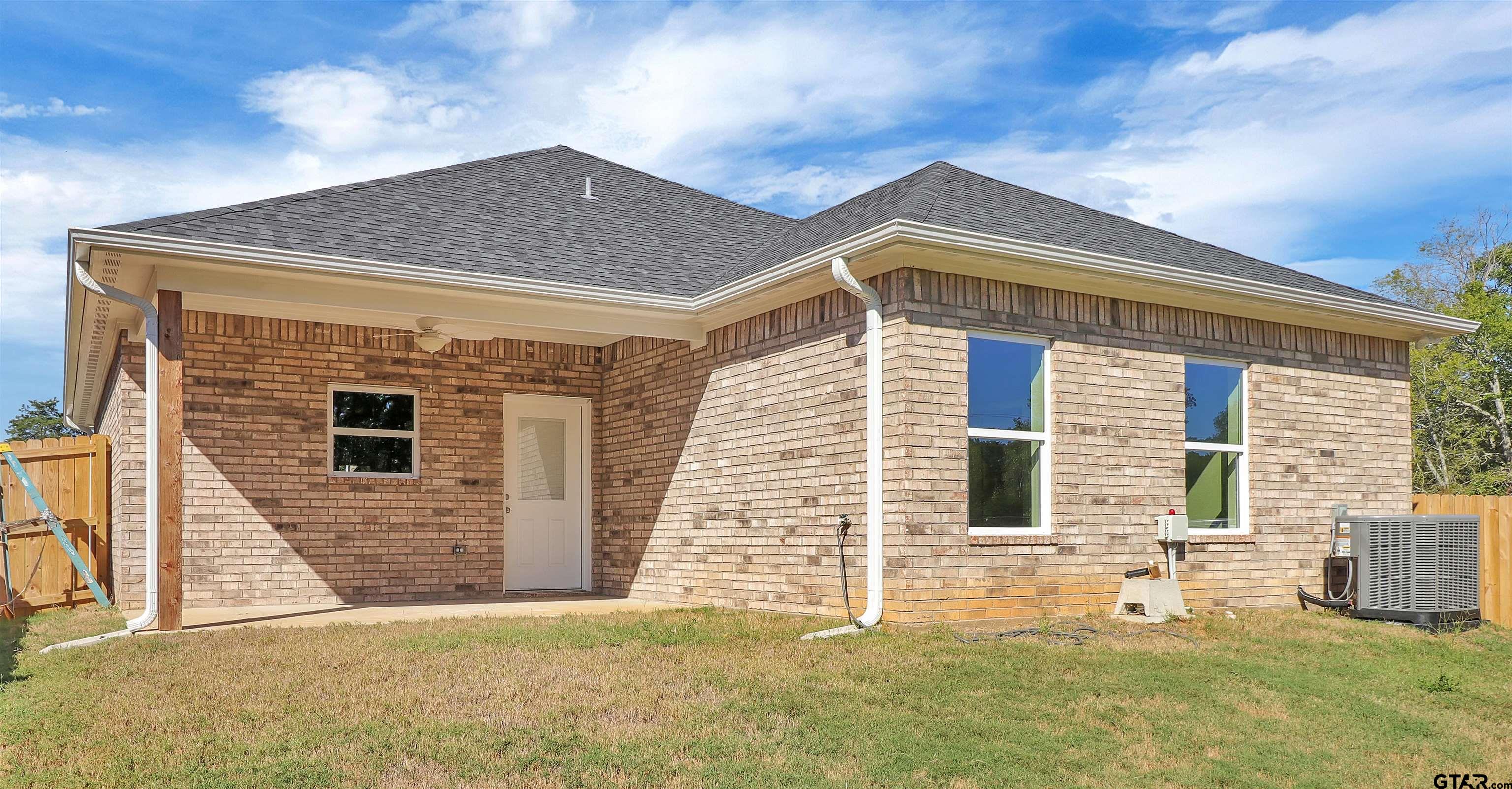 614 North Commerce Street Overton, TX 75684 - Photo 22 of 24 a front view of house with yard