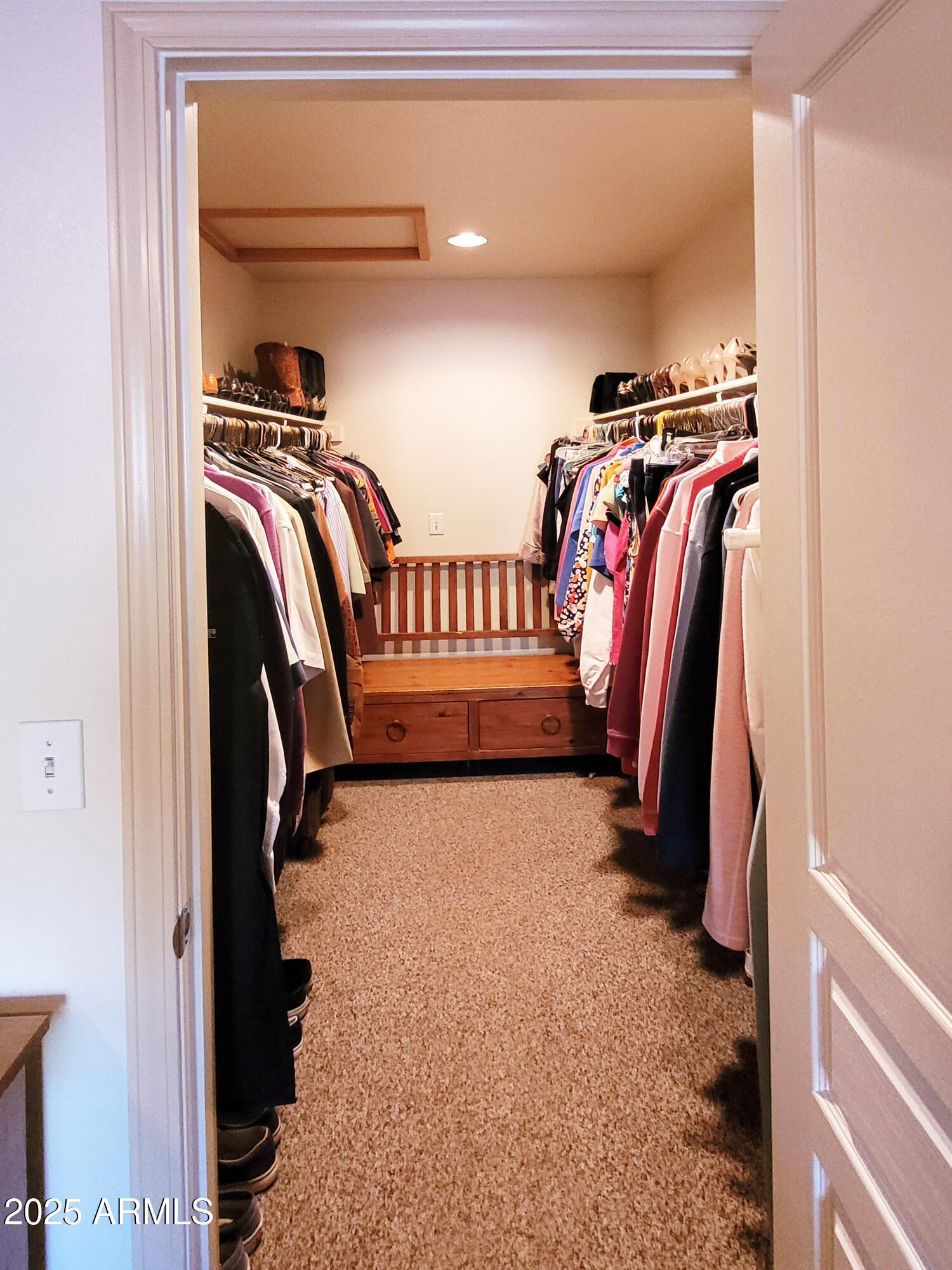 5579 Solitude Trail Loop Pine, AZ 85544 - Photo 33 of 50 a view of walk in closet with clothes and shoes