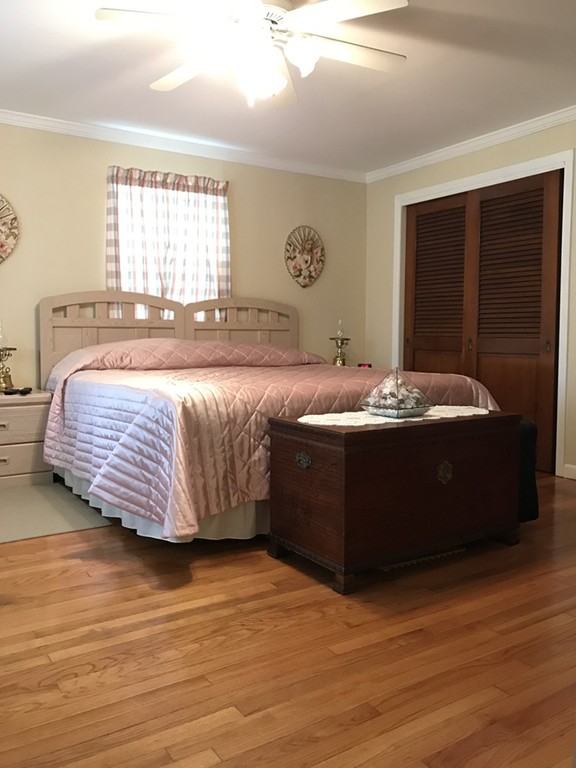 104-106 Milton Street Springfield, MA 01151 - Photo 12 of 17 a bedroom with a bed and window