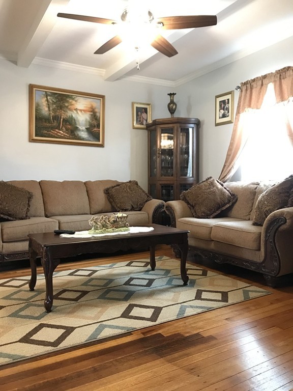 104-106 Milton Street Springfield, MA 01151 - Photo 8 of 17 a living room with furniture or couch and a window