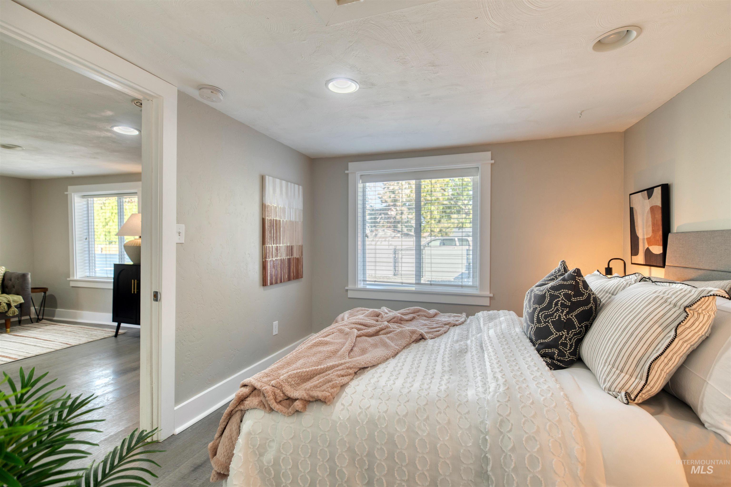 3311 West Hamilton Street Boise, ID 83705 - Photo 13 of 32 Bedroom featuring multiple windows, wood finished floors, and recessed lighting