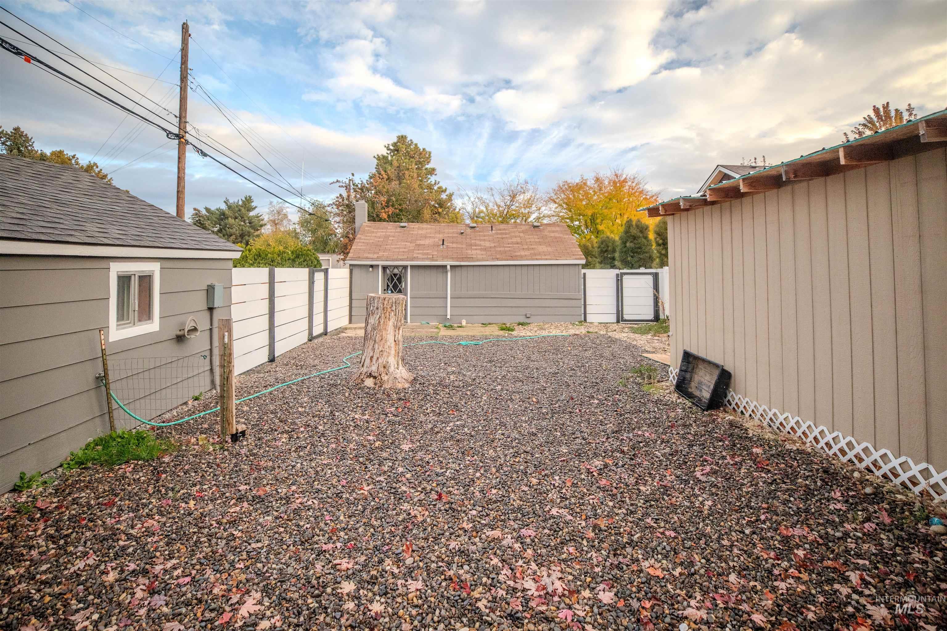 3311 West Hamilton Street Boise, ID 83705 - Photo 19 of 32 Fenced backyard featuring storage shed.