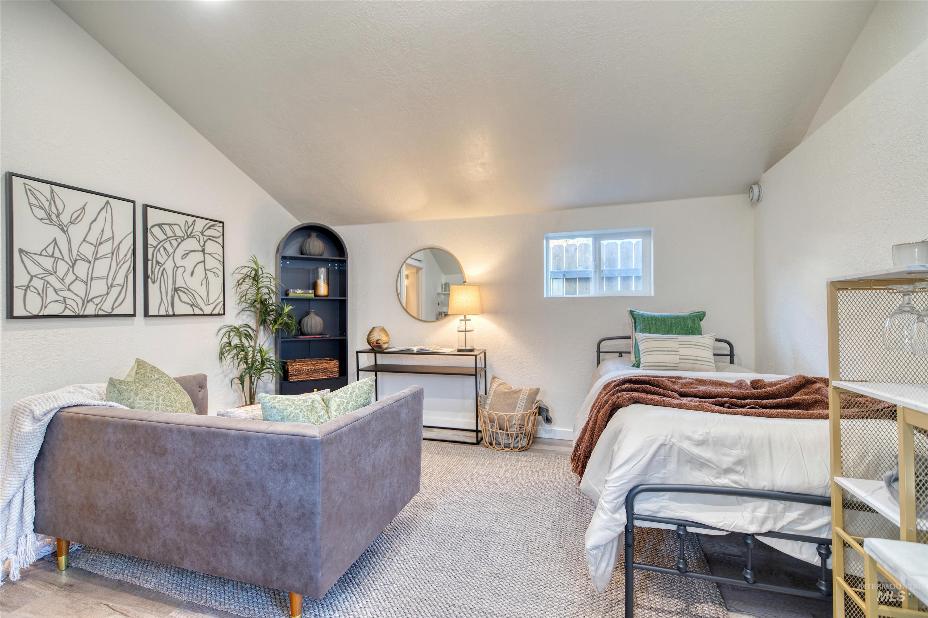 3311 West Hamilton Street Boise, ID 83705 - Photo 24 of 32 Bedroom featuring vaulted ceiling and baseboards