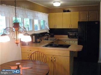 6 Firtree Road Levittown, PA 19056 - Photo 2 of 12 a bathroom with a sink and a mirror