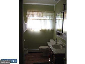 6 Firtree Road Levittown, PA 19056 - Photo 11 of 12 a bathroom with a sink toilet and window
