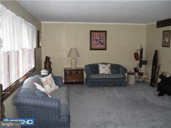 6 Firtree Road Levittown, PA 19056 - Photo 6 of 12 a living room with furniture and a flat screen tv