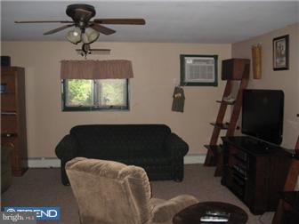6 Firtree Road Levittown, PA 19056 - Photo 7 of 12 a living room with furniture and a flat screen tv