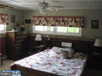 6 Firtree Road Levittown, PA 19056 - Photo 8 of 12 a room with a table chairs and chandelier