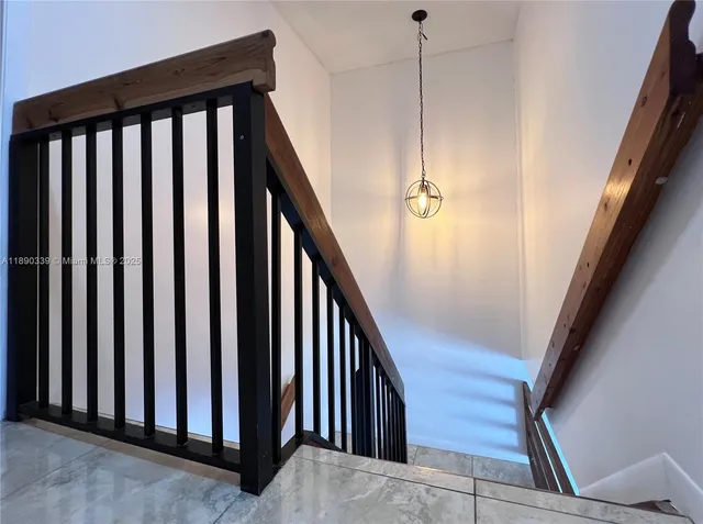 a view of a hallway with staircase
