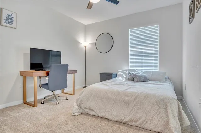 a bathroom with a granite countertop sink and a mirror a bathtub