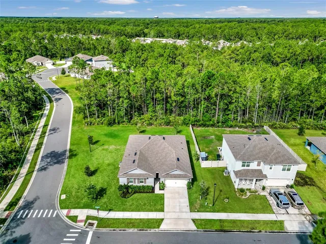 an aerial view of a house with a garden