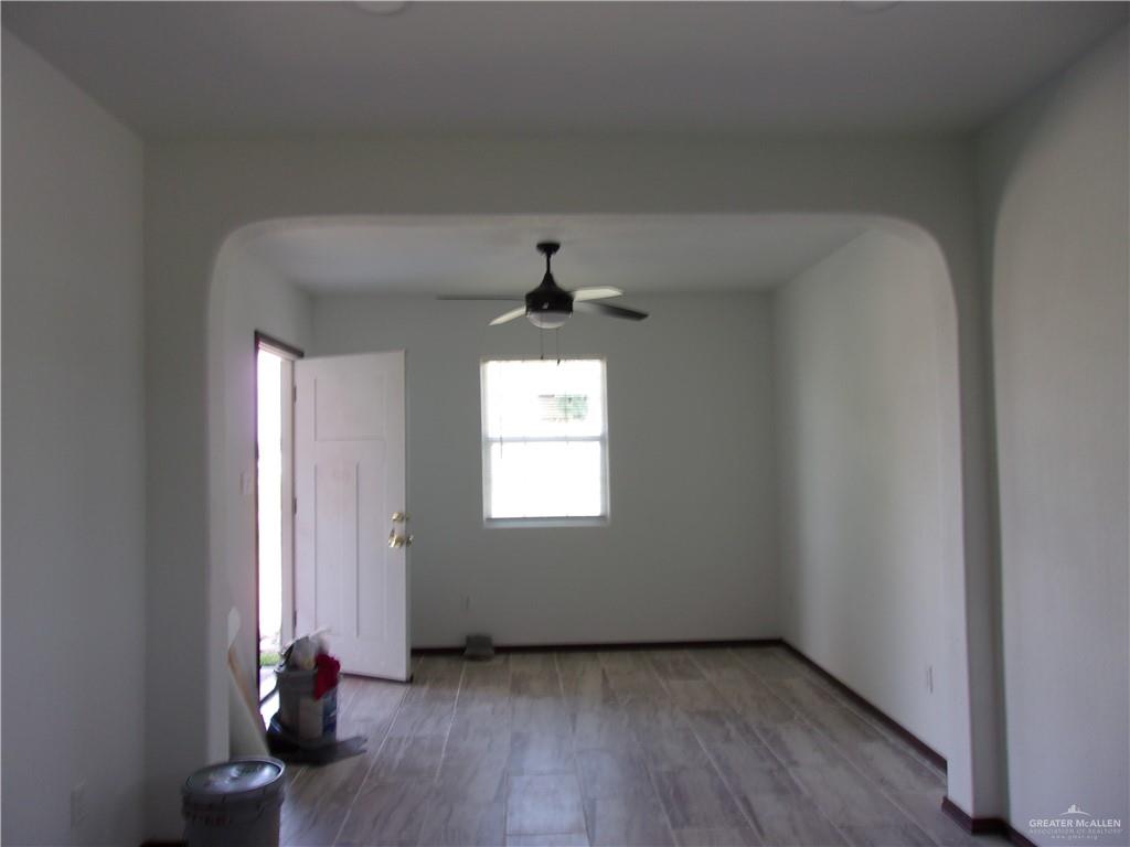 5 Mile Line Road Mission, TX 78573 - Photo 3 of 9 wooden floor in an empty room with a window