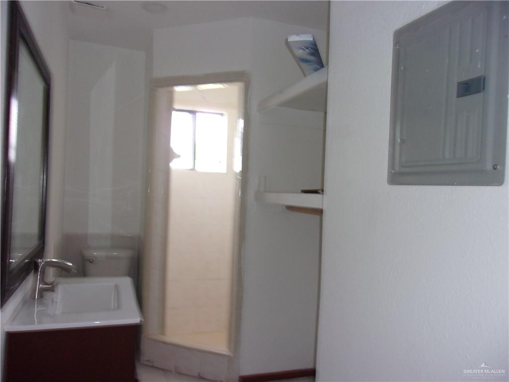 5 Mile Line Road Mission, TX 78573 - Photo 6 of 9 a bathroom with a sink and a mirror