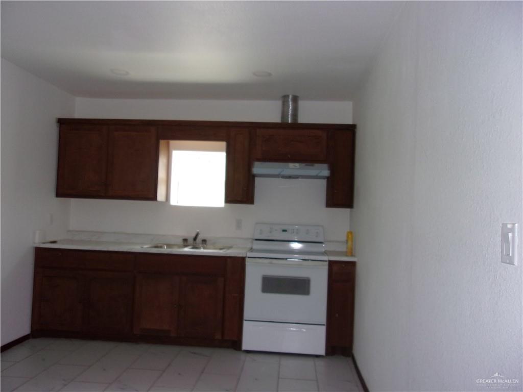 5 Mile Line Road Mission, TX 78573 - Photo 7 of 9 a bathroom with a sink and a mirror