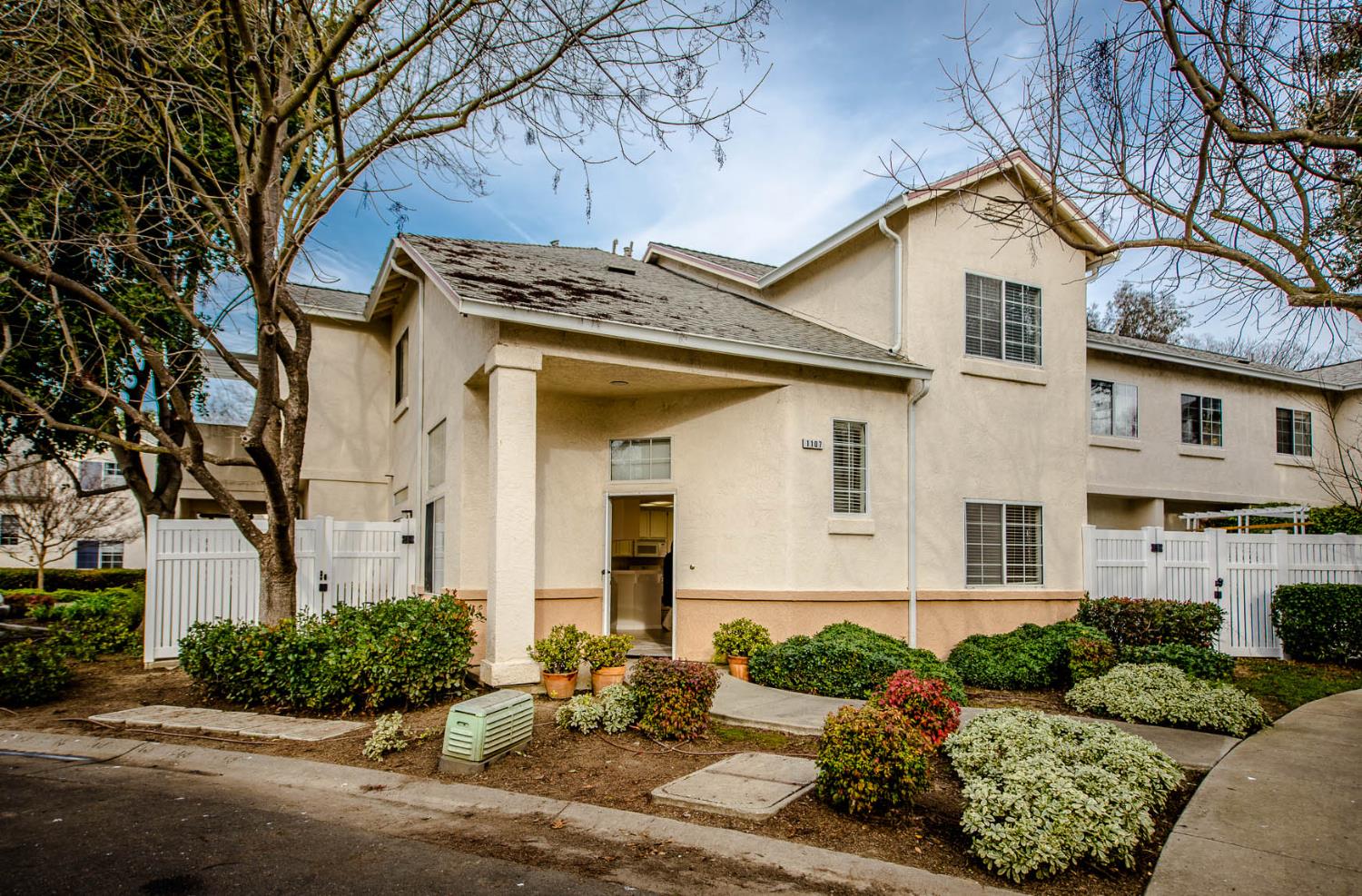 1107 Greene Terrace Davis, CA 95618 - Photo 2 of 28 a front view of a house with a yard