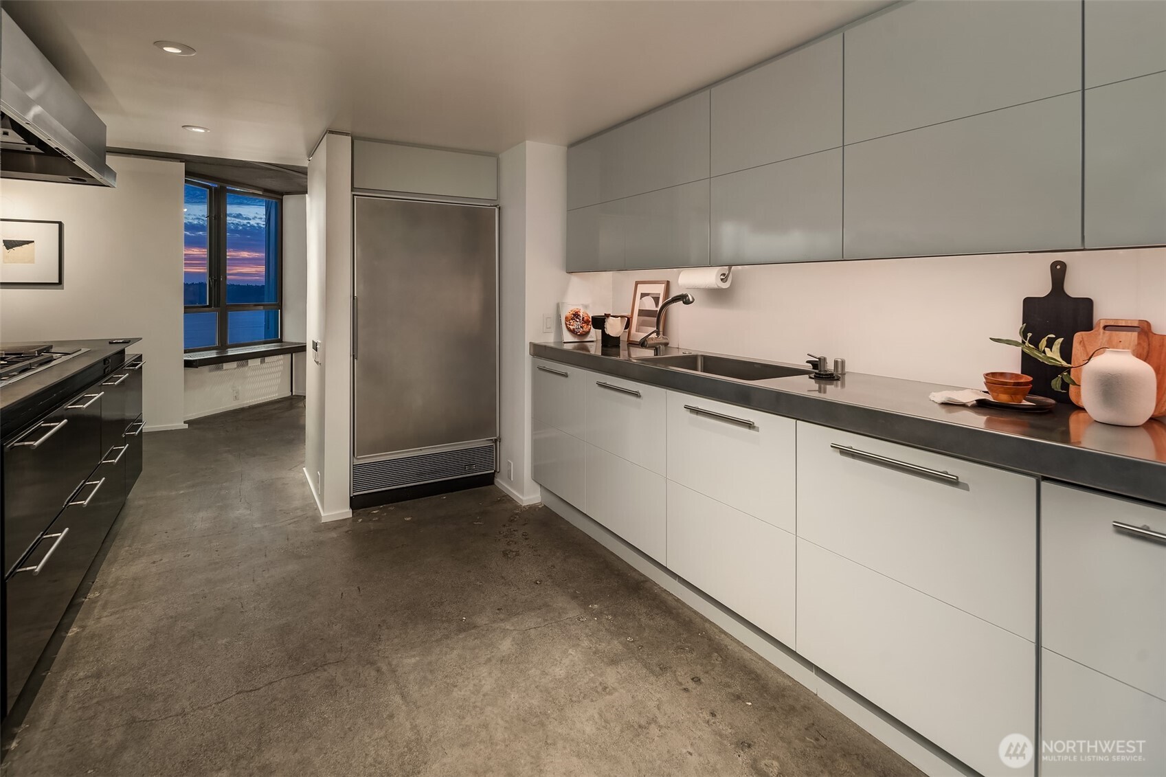 2201 3rd Avenue, Unit 2601 Seattle, WA 98121 - Photo 17 of 40 a kitchen with stainless steel appliances a sink stove and refrigerator