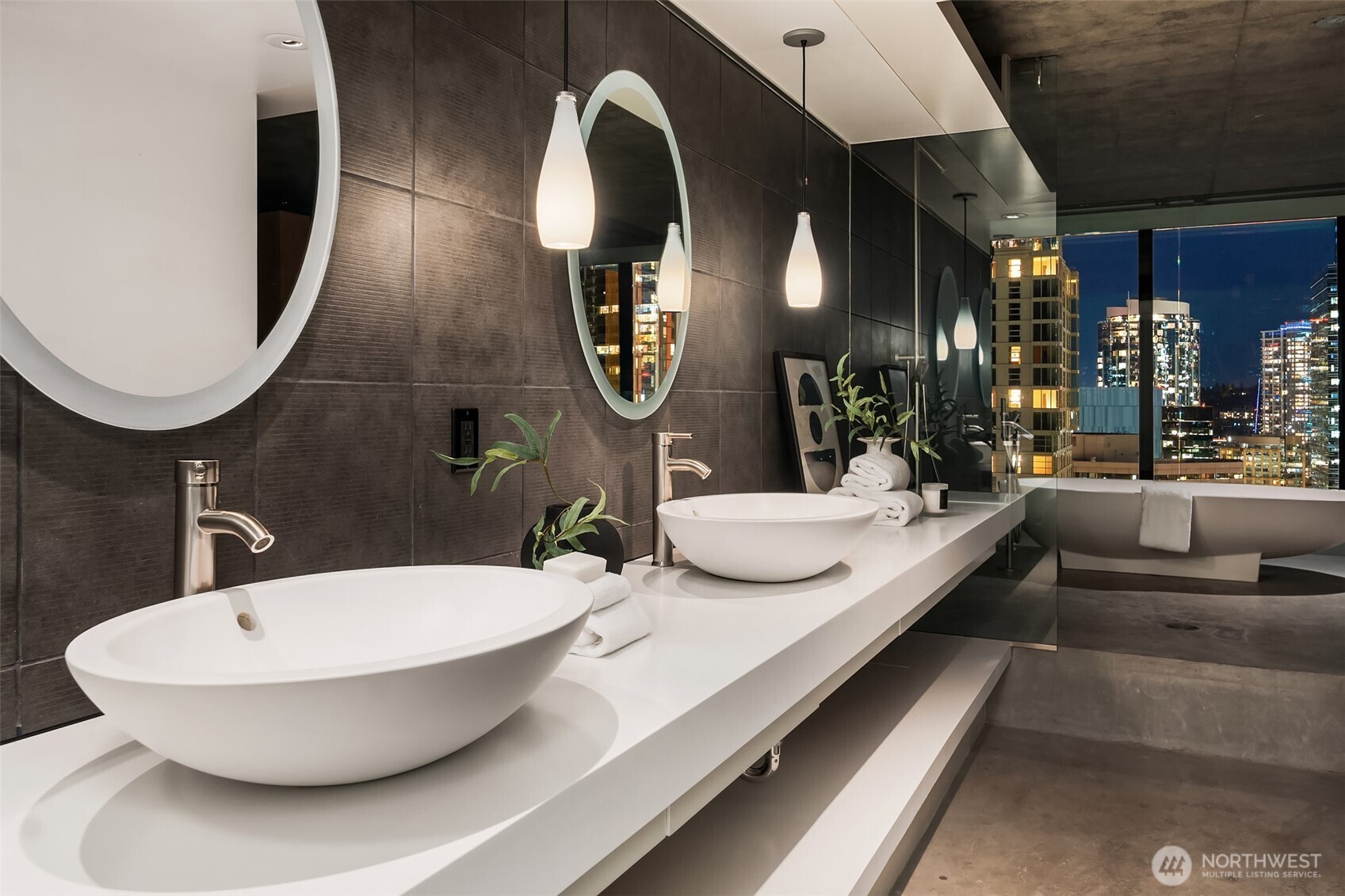 2201 3rd Avenue, Unit 2601 Seattle, WA 98121 - Photo 25 of 40 a bathroom with a double vanity sink and a mirror