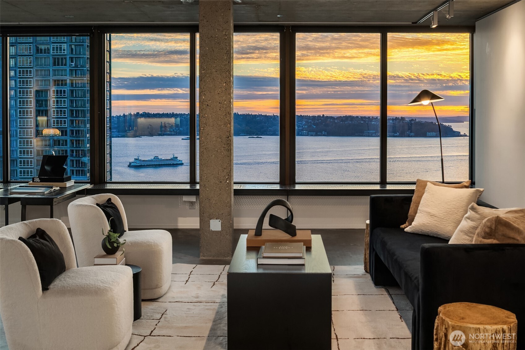 2201 3rd Avenue, Unit 2601 Seattle, WA 98121 - Photo 3 of 40 a living room with furniture and floor to ceiling windows