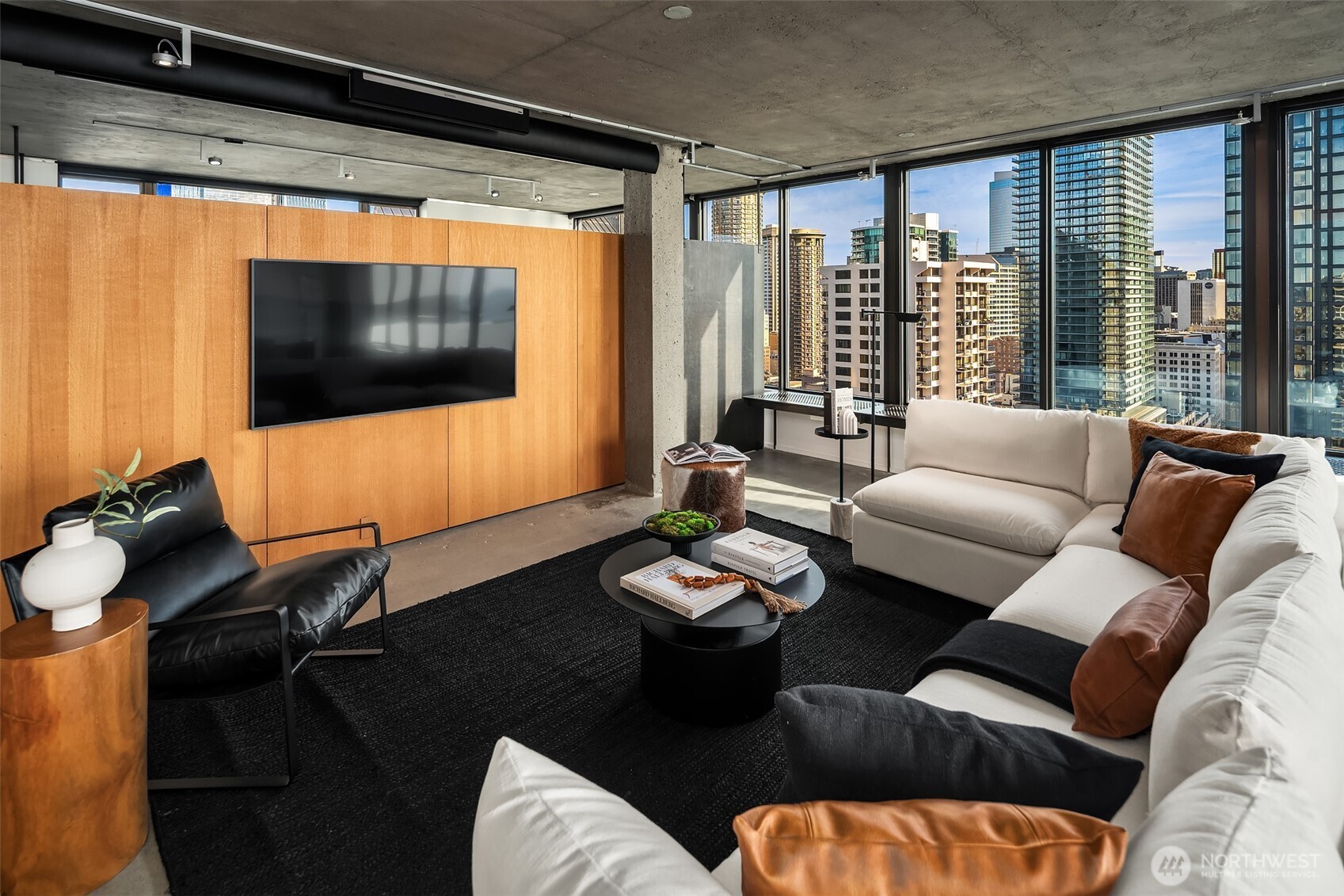 2201 3rd Avenue, Unit 2601 Seattle, WA 98121 - Photo 6 of 40 a living room with furniture and a flat screen tv
