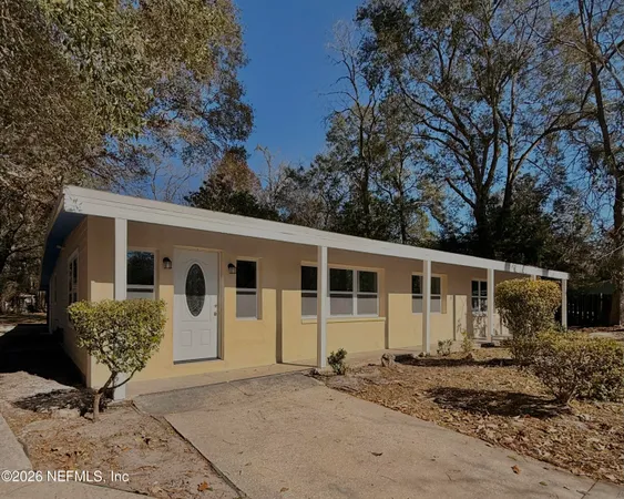 a view of a back yard of the house