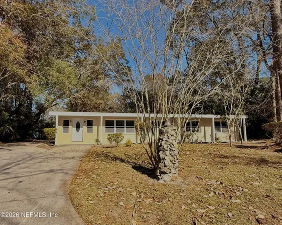 a house with trees in the background