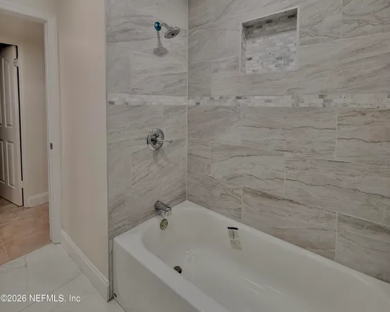 a bathroom with a bathtub