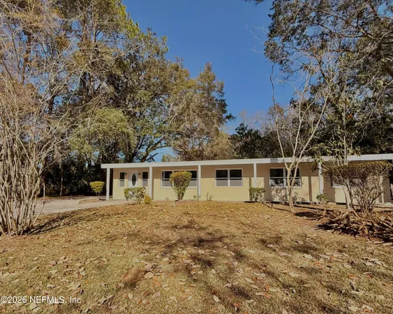 a house with trees in the background