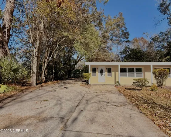 a view of a backyard of the house
