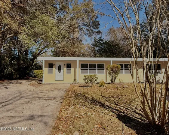 front view of a house with a large window