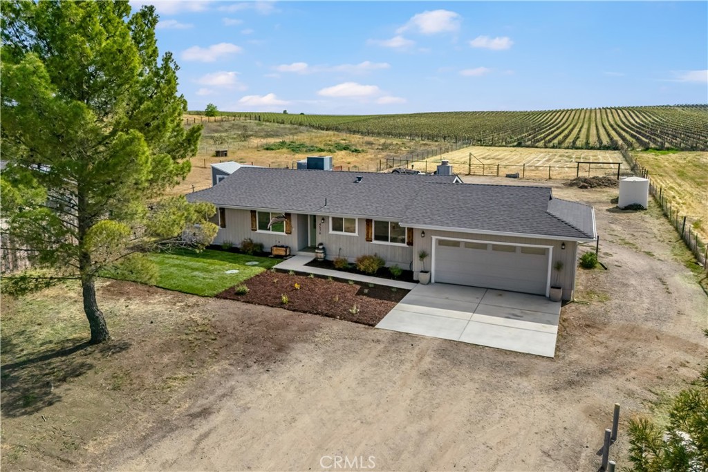 4576 Farousse Way Paso Robles, CA 93446 - Photo 1 of 1 a view of a terrace with a lawn chairs under an umbrella