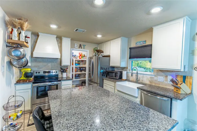 a bedroom with a bed and a table