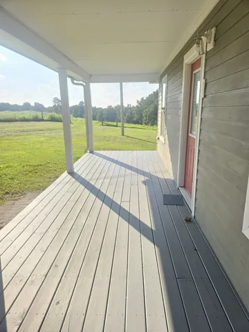 a view of wooden floor with a balcony