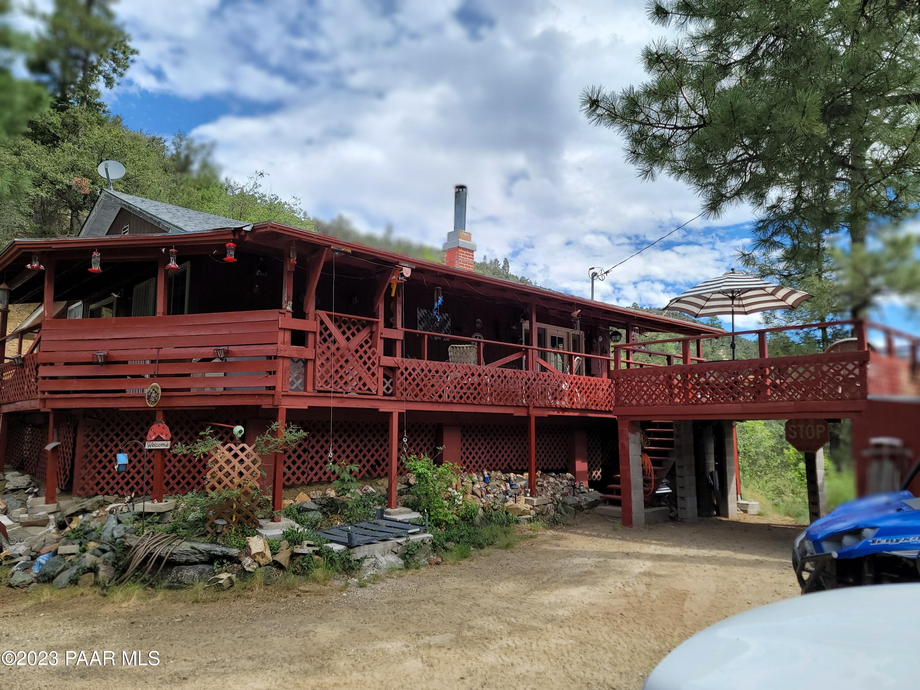 8000 South Breezy Pine Road Mayer, AZ 86333 - Photo 1 of 1 a view of a house with a balcony and balcony
