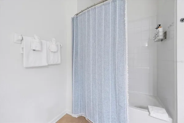 a en suite bathroom with a double vanity sink a mirror and a shower