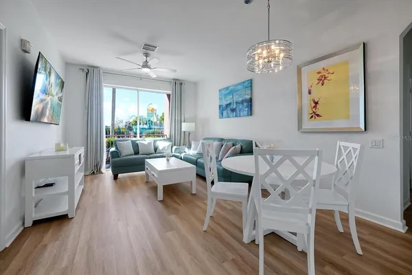 a living room with fireplace furniture and a wooden floor