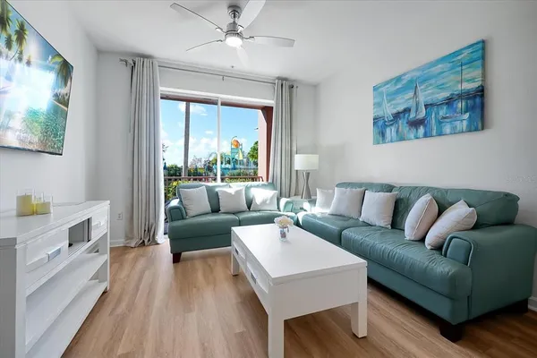 a living room with furniture and a large window